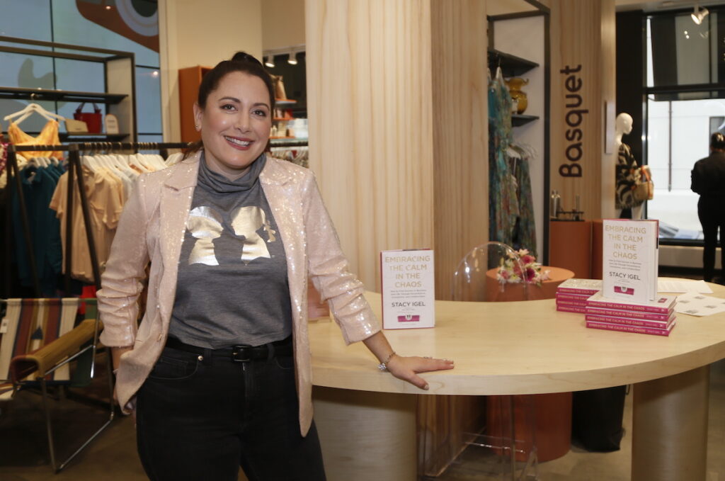 Stacy Igel with her book, Embracing the Calm in the Chaos