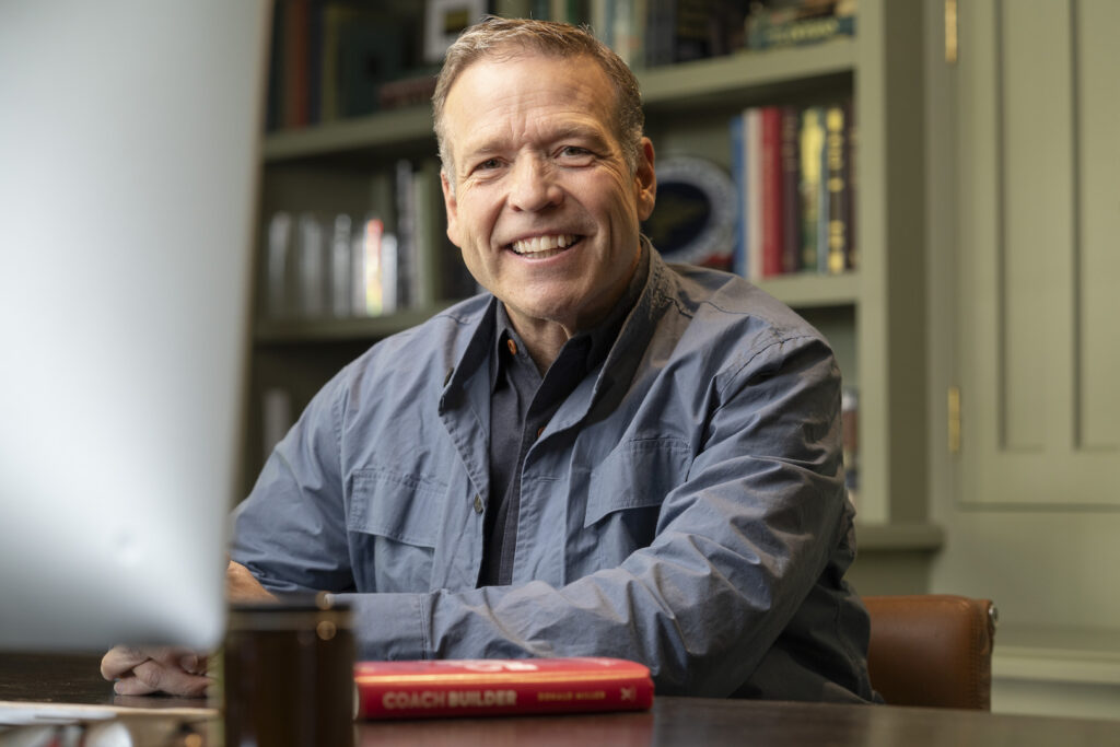 Donald Miller with a copy of Coach Builder