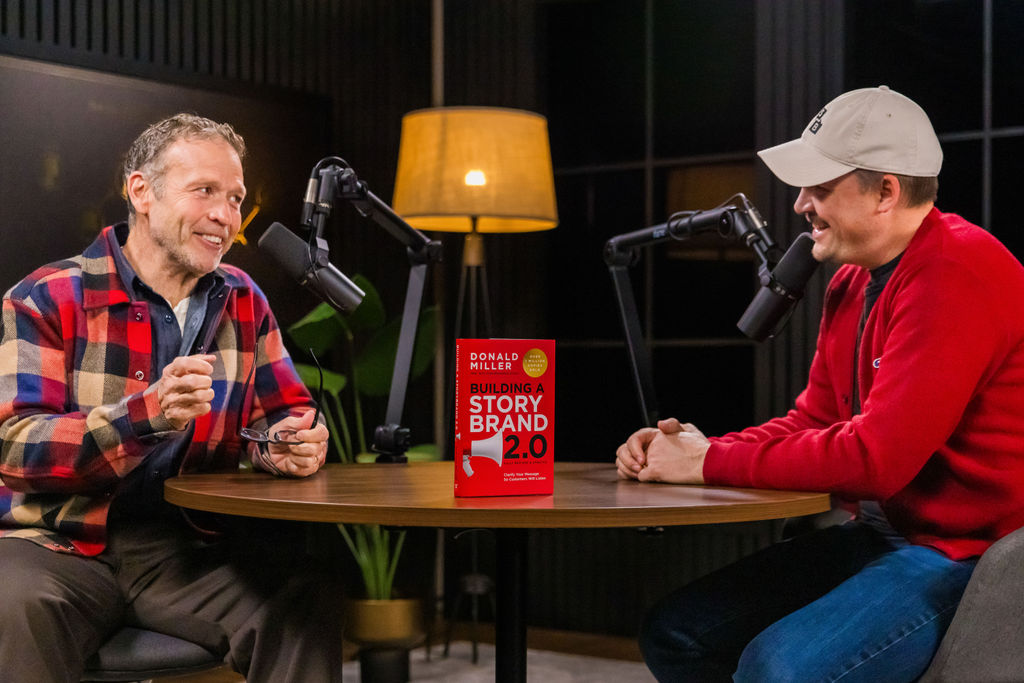 Donald Miller with a copy of "Building a StoryBrand 2.0"