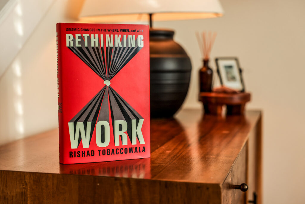 A copy of Rethinking Work on a table